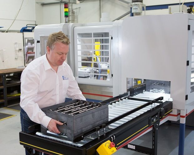 e-tech worker operating a machine